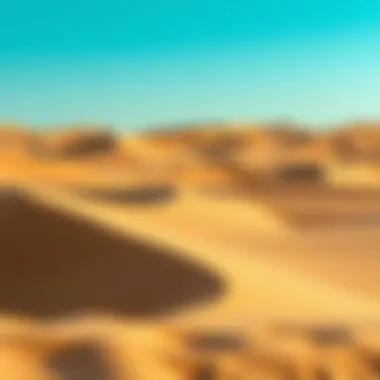 The serene beauty of the Dubai Desert with rolling dunes under a clear blue sky.